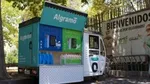 Algramo electric trike with dispensing machine that allows consumers to refill their OMO and Quix containers at home.